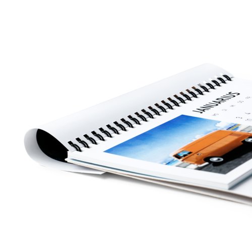 Paper table calendar with spiral binding.