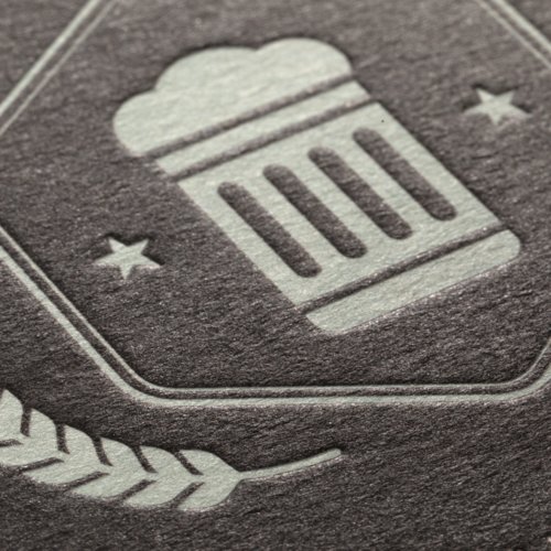 Round beer coaster with blind embossing.