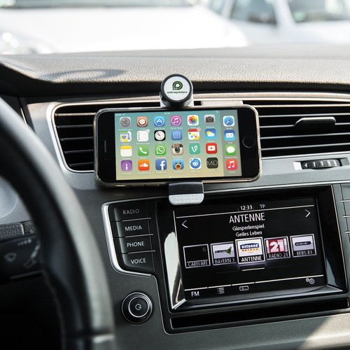 Black plastic phone holder for car mounting.