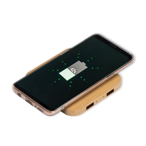 Beige bamboo charger for wirelessly charging devices.