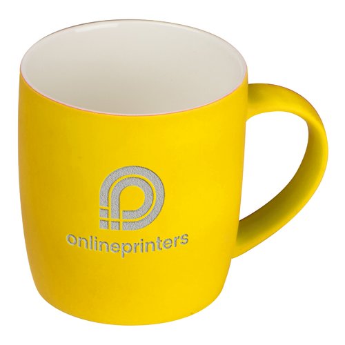Yellow ceramic mug with handle.