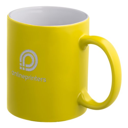 Yellow ceramic mug with handle.