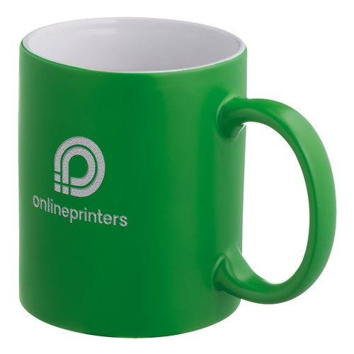 Green ceramic mug with rounded handle.