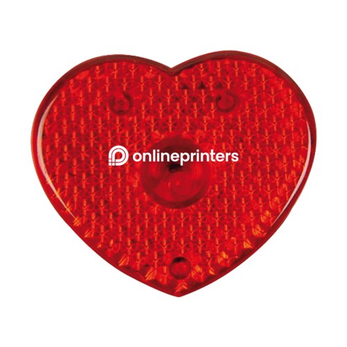 Red heart-shaped flashing light with clip for attachment.