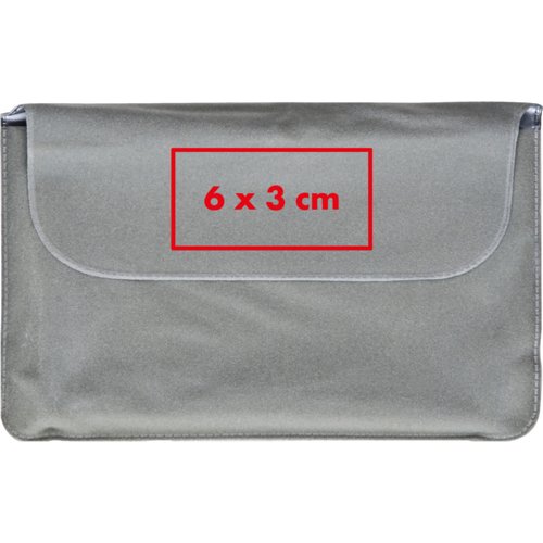 Gray neck pillow with closure flap.