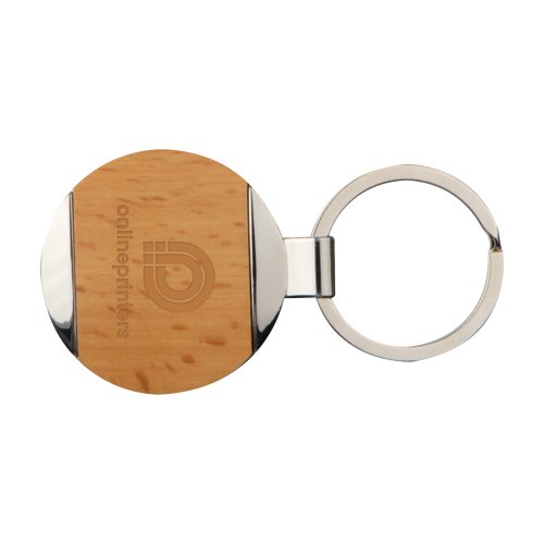 Brown metal and wood keychain with pattern and metal ring.