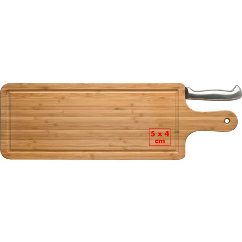 Light bamboo cutting board with juice groove and knife.
