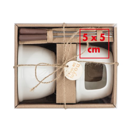 White ceramic chocolate fondue set with forks.