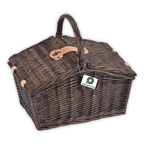 Brown Wicker picnic basket with handle and closure.