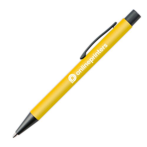 Yellow plastic ballpoint pen with clip and push button.