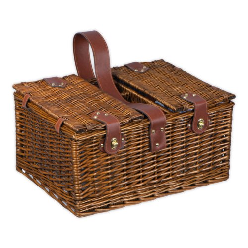 Brown wicker picnic basket with lid and carrying handle.