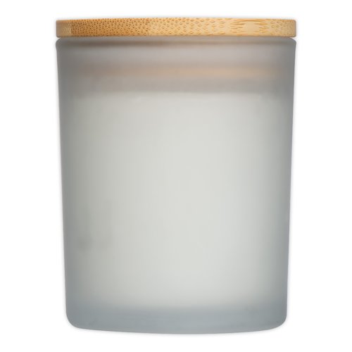 White candle in glass with wooden lid.