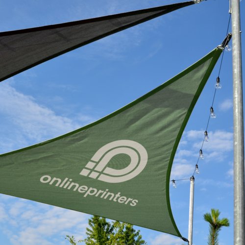 Triangular canvas sun sail with mounting eyelets.