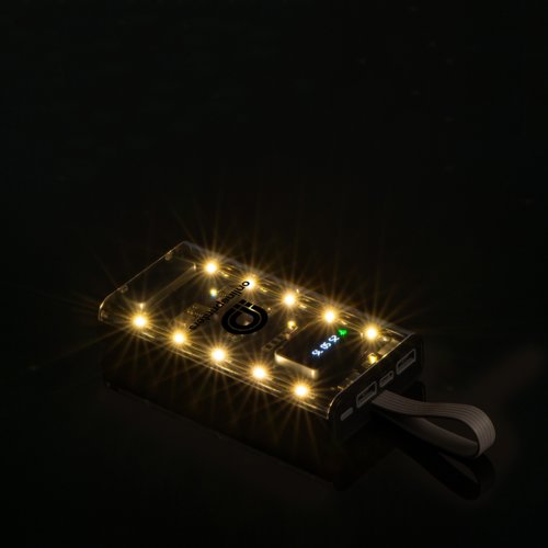 Transparent power bank with USB ports and LED lights.