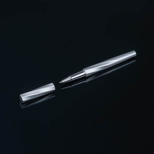 Brass-colored rollerball pen with cap.