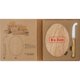 Wooden cheese board with cheese knife.