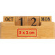 Wooden desk calendar with date blocks.