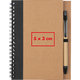 Notepad with spiral binding and pen holder.