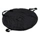 Black fabric beach banner with flexible frame and carrying handles.