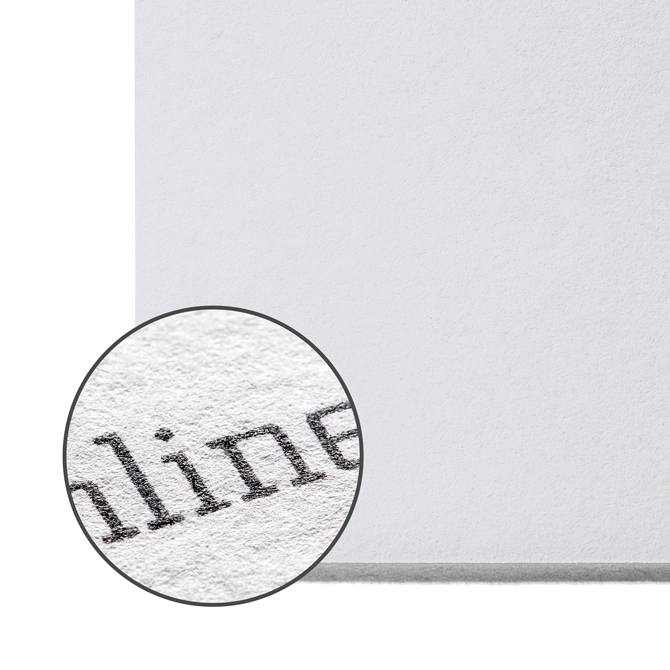 Image Macro shot of recycled cardstock with a matt, slightly uneven surface made from recycled material.
