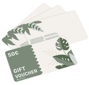 A €50 gift voucher decorated with green and beige tropical leaves, placed on top of three similar blank cards with leaf designs.